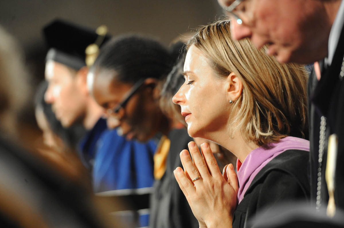 Faculty praying